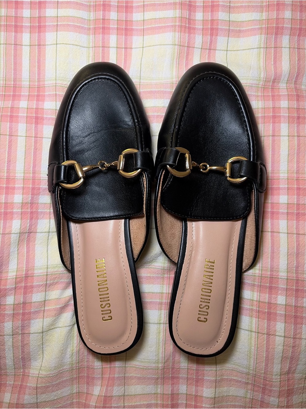 Cushionaire black leather loafers with gold buckle detail